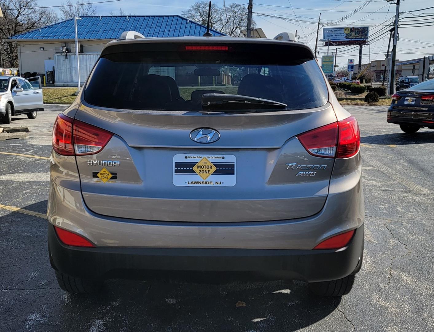 2012 Brown /Black Hyundai Tucson Limited (KM8JUCAC7CU) with an 4-Cyl, PZEV, 2.4 Liter engine, Automatic transmission, located at 341 N White Horse Pike, Lawnside, NJ, 08045, (856) 262-9500, 39.855621, -75.027451 - Photo#4